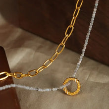Layered titanium steel necklace with 18k gold-plated chain and beaded pendant