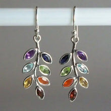 Silver-toned leaf shape alloy earrings with multicolored marquise gems