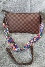 Leather studded shoulder bag with brown checkerboard pattern