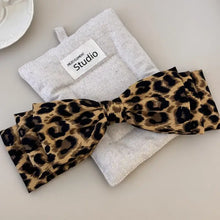 Leopard print bow tie with silver glitter and white label hair clip