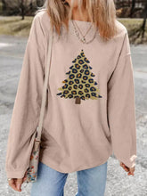 Beige corduroy long-sleeve oversized fit top featuring a leopard christmas tree graphic with care instructions