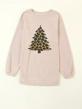A soft pink corduroy long-sleeve top with oversized fit and leopard christmas tree appliqué featuring care instructions