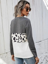 Leopard color block twisted tee with shiny leopard cow print panel