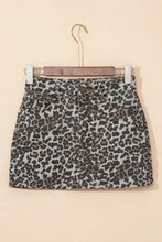 Black and gray leopard denim mini skirt made of denim hanging on wooden hanger for stylish casual wear