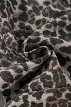 Leopard denim mini skirt made of textured leopard-print denim fabric with a slightly worn appearance