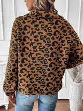 Women’s brown black leopard half zip long sleeve sweatshirt over jeans