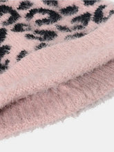 Pink and black leopard print fluffy knit fabric in leopard hat with pompom