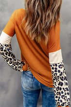 Leopard long sleeve round neck sweatshirt with orange shirt and blue jeans