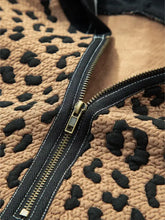 Tan and black leopard-print fleece quarter zip hoodie with gold-toned zipper and slightly stretchy fabric