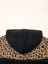Black quarter zip hoodie with tan and black leopard patchwork on shoulders and knotted cuffs in slightly stretchy fabric