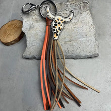 Leopard print bull shape fringe keychain with leather tassels and metal clasp