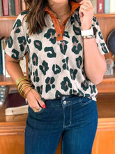 Leopard print short sleeve blouse with contrasting tan collar and buttoned placket in soft fabric