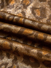 Rich metallic brown leopard print button-down shirt fabric with subtle gold leaf pattern and luxurious satin sheen