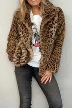 Leopard print faux fur coat with white tee and black jeans