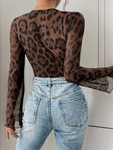 Leopard print lace mesh bodysuit with high-waisted jeans