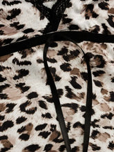Leopard print lace trim cami featuring tan and black spots with black lace trim at the neckline