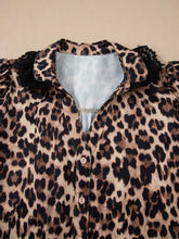 Leopard print lace short sleeve shirt with black lace trim collar puff sleeves and light blue inner lining