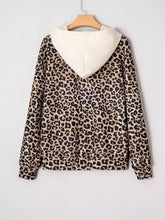 Leopard print long sleeve hoodie with pocket in beige and black featuring a cream interior and slightly stretchy fabric