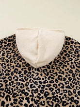Beige ribbed knit hoodie with leopard print long sleeve slightly stretchy fabric and machine wash care pocket design