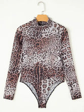 A sheer leopard print long sleeve bodysuit with a ruffled mock neck and black trim along the leg openings