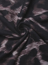 Black and metallic gray tie-dye mesh fabric with an abstract pattern on leopard print one shoulder long sleeve bodysuit