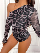 Sheer black and gray leopard print one shoulder long sleeve bodysuit with a fitted design and stylish cut