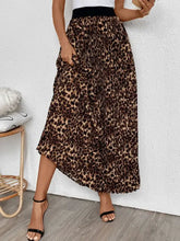 Leopard print pleated maxi skirt with black waistband and pockets