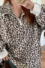 A cozy cream corduroy leopard print quarter-zip sweatshirt with white zipper collar machine wash cold recommended