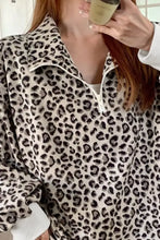 Leopard print quarter-zip sweatshirt in ribbed corduroy with black and beige pattern and white zipper detail machine wash cold