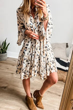 Leopard print ruffled dress with bell sleeves and floral accents