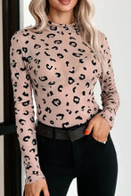 Sheer mesh bodysuit in pink with black leopard print sheer long sleeves and high neckline design
