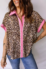 Leopard print short sleeve button-up shirt with pink collar and sleeve cuffs for stylish casual wear