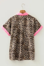 Leopard print short sleeve blouse in beige and brown with bright pink trim on collar and sleeve cuffs