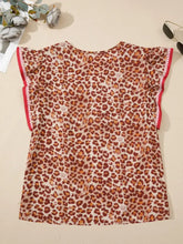 Women’s leopard print smocked notched blouse with ruffled sleeves trimmed in red and white striped fabric