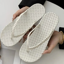 White polka dot toe post flats slippers with textured soles and gold accents