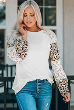 Leopard round neck drop shoulder T-shirt with white top and blue jeans