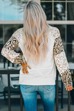 Woman in leopard round neck drop shoulder T-shirt from back