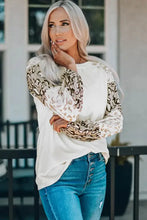 Women’s ivory leopard round neck drop shoulder blouse