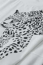 White long sleeve leopard round neck top with black jaguar print