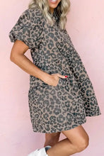 Women’s short-sleeved denim dress with muted gray and black leopard print, round neck puff sleeves, and tiered layers