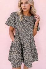 Women’s gray and black leopard print denim dress with round neck puff sleeves, tiered skirt, and front pockets