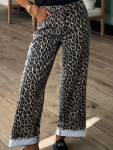 Wide-leg denim pants with bold black and gray leopard print featuring rolled cuffs in a leopard straight loose style