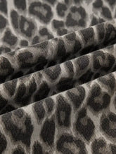 Black and gray leopard straight loose leg jeans in corduroy fabric with a textured ribbed surface