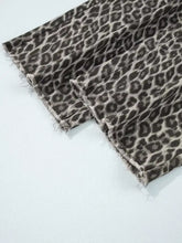 Black and gray leopard straight loose denim jeans with frayed hems featuring a loose leg design