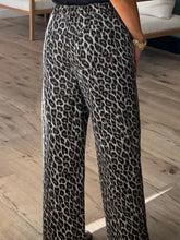 Black and gray leopard straight loose leg jeans featuring a loose leg design in a leopard print pattern