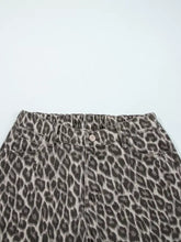 High-waisted denim leopard straight loose jeans with muted gray and black leopard print and loose leg design
