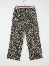 Wide-leg denim pants with bold brown and beige leopard straight loose print and frayed hems in leopard straight loose style