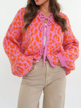Vibrant leopard print tie-front cardigan in pink and orange