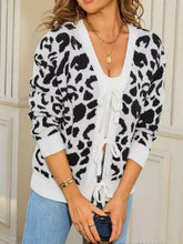 Leopard tie-front cardigan in black and white print with ribbed cuffs