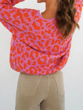 Leopard print tie-front cardigan in vibrant pink and orange knit
